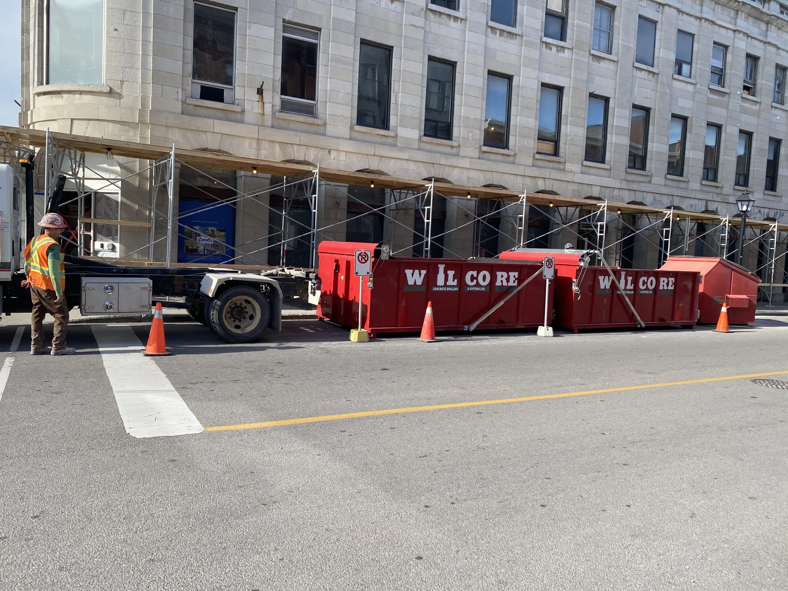 Photo of a Wilcore truck and two Wilcore dumpsters